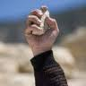 Hand holding a Stone