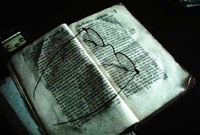 Spectacles on an Open Bible