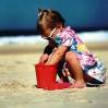 child playing in sand